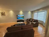 Living room with sofa and television — Stylish Getaway 3BR with Heated Pool