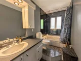 Full bathroom — Spacious 3BR Home with Private Backyard