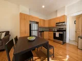 Full kitchen in the two-bedroom Plateau apartment — Cozy Heritage 2BR with Lush Private Garden Patio