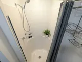 Shower and bathroom fixtures — Spacious 2BR Holiday Home Near YUL