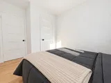 Second queen bedroom with closet and room-darkening curtains — Modern 3BR Spacious Home
