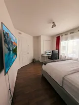 Bedroom with dedicated desk and chair — Modern 1BR with Private Bath