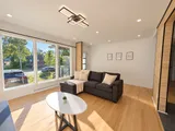 Living room sectional beside the front window — Modern 3BR Spacious Home