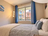 Second bedroom TV and window — Bright 2BR Retreat