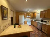 Kitchen and dining table — Stylish Getaway 3BR with Heated Pool