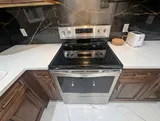 Electric stove and oven — Spacious 2BR Holiday Home Near YUL