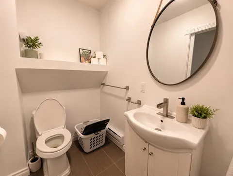 Bathroom sink and toilet — Luxury 2BR in the Plateau