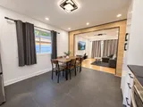 Dining area opening onto the living room — Modern 3BR Spacious Home