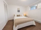 Second queen bedroom beside the window and closet — Cozy 2-Bedroom Retreat