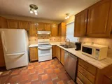 Kitchen with stove and refrigerator — Stylish Getaway 3BR with Heated Pool