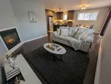 Living area opening onto the kitchen — Modern 1BR with Desk Near YUL