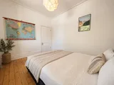 Queen bedroom storage and interior details — Cozy Heritage 2BR with Lush Private Garden Patio