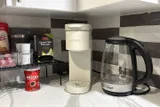 Coffee maker and drink supplies — Stylish Modern 1BR with EV Charger